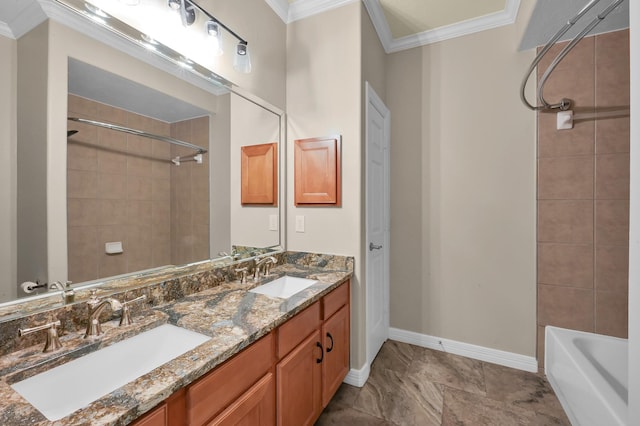bathroom with double vanity, baseboards, ornamental molding, and a sink