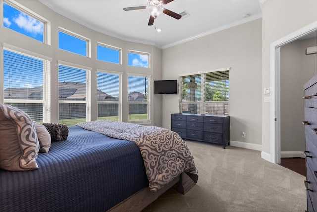 bedroom with light carpet, a ceiling fan, baseboards, visible vents, and ornamental molding