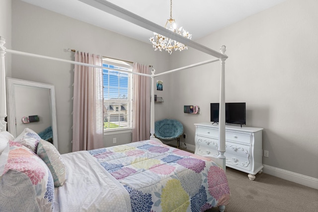 bedroom featuring baseboards, carpet flooring, and a notable chandelier