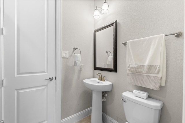 bathroom featuring toilet