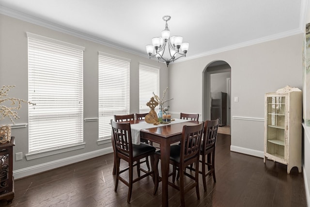 dining space featuring arched walkways, baseboards, a notable chandelier, and dark wood-type flooring