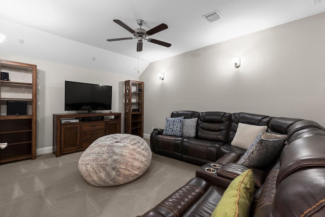 living room with ceiling fan, visible vents, vaulted ceiling, baseboards, and light carpet
