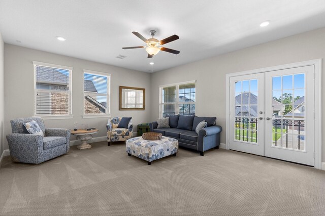 carpeted living area featuring baseboards, ceiling fan, french doors, and recessed lighting