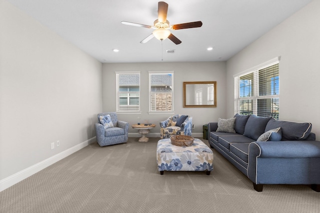 carpeted living area featuring baseboards, a ceiling fan, visible vents, and recessed lighting
