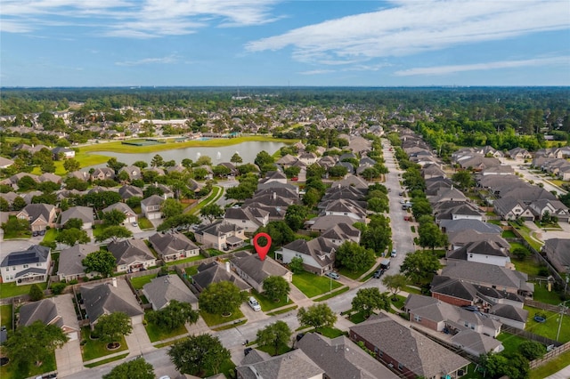 bird's eye view featuring a residential view and a water view