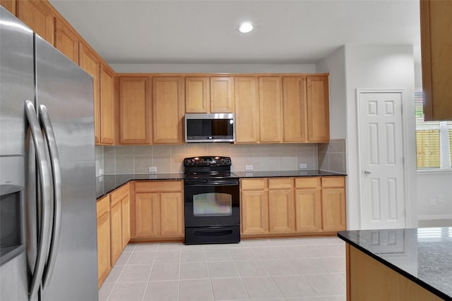 kitchen with appliances with stainless steel finishes, dark stone counters, recessed lighting, decorative backsplash, and light tile patterned floors