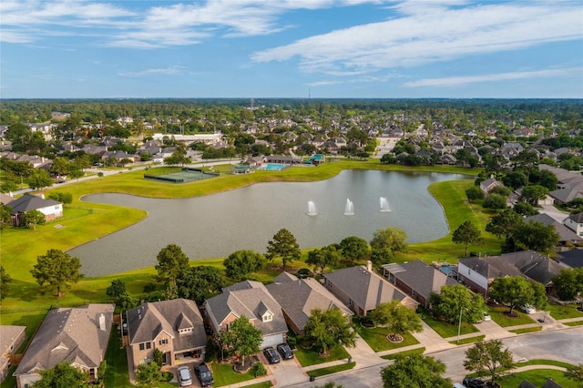 drone / aerial view featuring a water view and a residential view