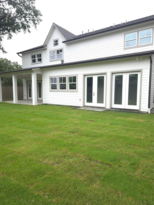 5518 Schumacher Ln, Houston, TX 77056 - back of property featuring french doors, a patio, and a lawn