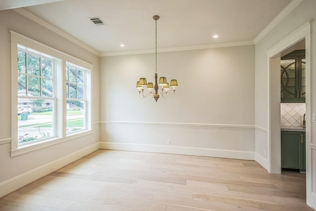 5518 Schumacher Ln, Houston, TX 77056 - unfurnished dining area with light wood-type flooring, a chandelier, crown molding, and recessed lighting