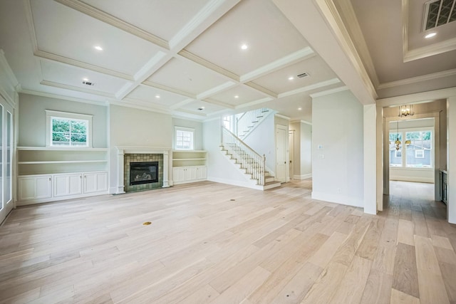 5518 Schumacher Ln, Houston, TX 77056 - unfurnished living room featuring a tile fireplace, coffered ceiling, light wood-style flooring, stairs, and beam ceiling