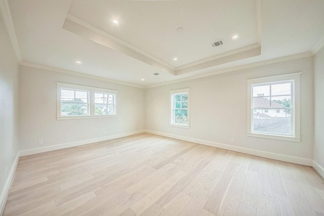 5518 Schumacher Ln, Houston, TX 77056 - empty room featuring a tray ceiling, light wood finished floors, and ornamental molding
