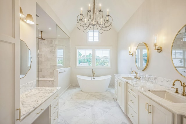 5518 Schumacher Ln, Houston, TX 77056 - bathroom with a chandelier, marble tiled flooring, double vanity, tiled shower, and a freestanding tub