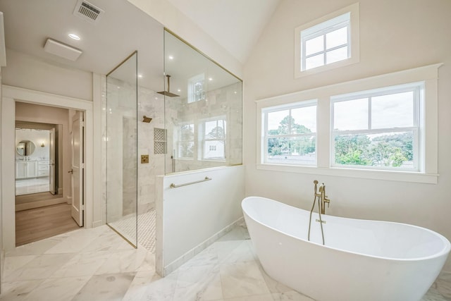 5518 Schumacher Ln, Houston, TX 77056 - full bathroom with a walk in shower, a freestanding bath, marble finish flooring, and lofted ceiling