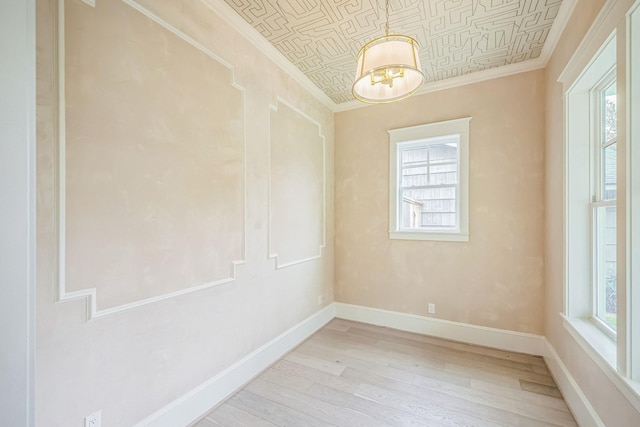 5518 Schumacher Ln, Houston, TX 77056 - empty room featuring ornamental molding, plenty of natural light, light wood-style flooring, and an ornate ceiling