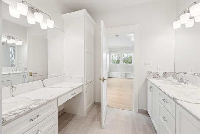5518 Schumacher Ln, Houston, TX 77056 - full bathroom with wood finished floors and two vanities
