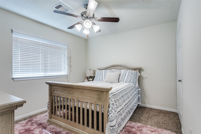 2017 Amado Ln, League City, TX 77573 - bedroom with carpet floors, baseboards, and a ceiling fan
