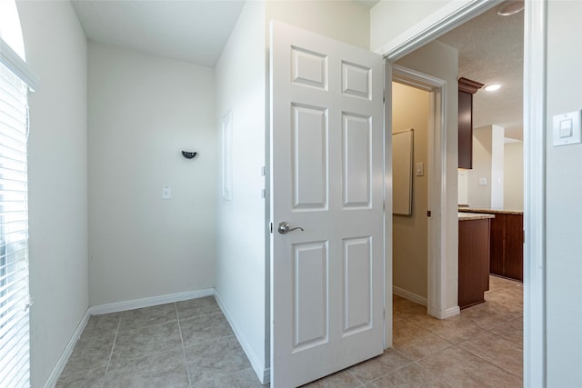 2017 Amado Ln, League City, TX 77573 - hall featuring light tile patterned flooring and baseboards
