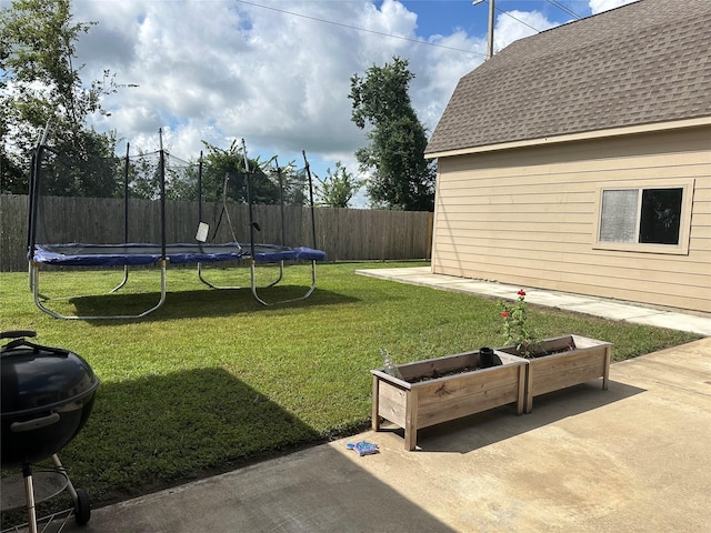 2017 Amado Ln, League City, TX 77573 - view of yard featuring a trampoline and a patio