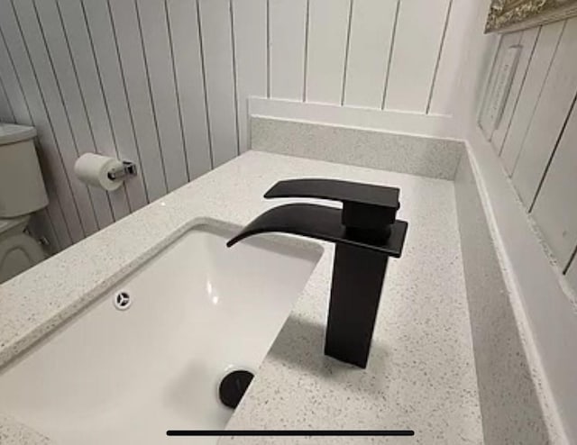 bathroom view of toilet and a sink
