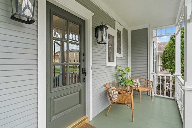 entrance to property featuring a porch