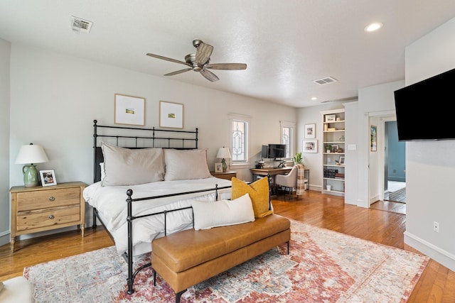 bedroom featuring visible vents, recessed lighting, and wood finished floors