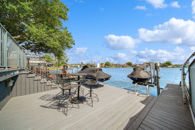 12858 Pelican Island Dr, Willis, TX 77318 - view of dock featuring a water view and boat lift