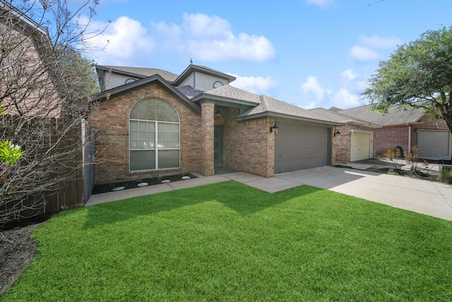 12858 Pelican Island Dr, Willis, TX 77318 - view of front facade featuring a shingled roof, an attached garage, a front lawn, brick siding, and concrete driveway
