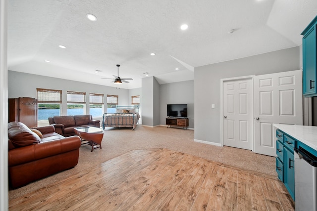 12858 Pelican Island Dr, Willis, TX 77318 - living room with recessed lighting, a ceiling fan, light wood-style flooring, and baseboards