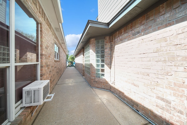 12858 Pelican Island Dr, Willis, TX 77318 - view of property exterior featuring brick siding