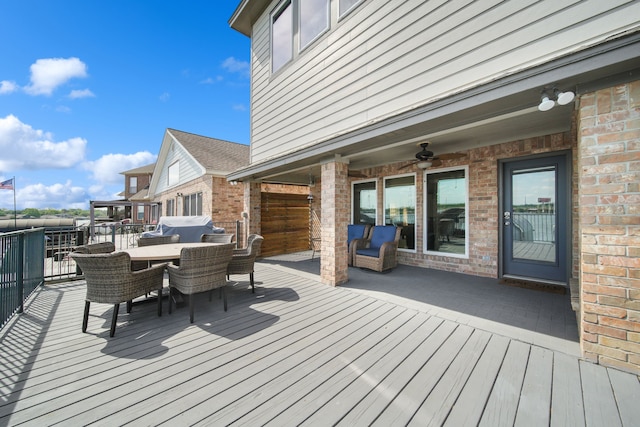 12858 Pelican Island Dr, Willis, TX 77318 - wooden deck featuring ceiling fan and outdoor dining space