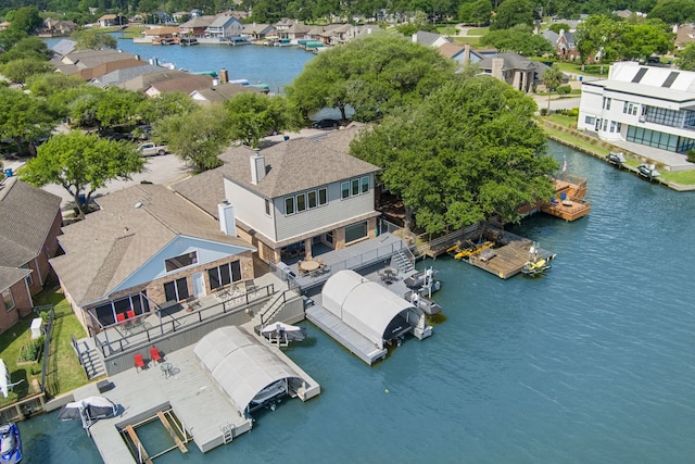 12858 Pelican Island Dr, Willis, TX 77318 - aerial view featuring a water view and a residential view