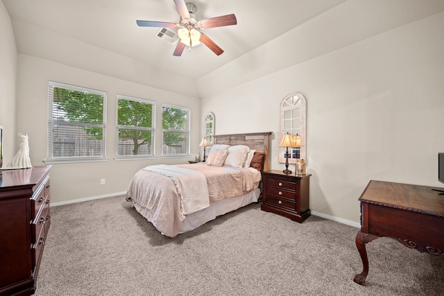 carpeted bedroom with baseboards, a ceiling fan, lofted ceiling, and visible vents