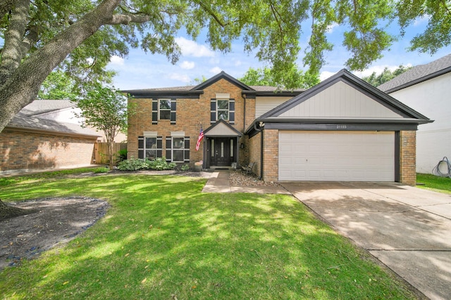 traditional-style house with fence, a front yard, brick siding, concrete driveway, and an attached garage