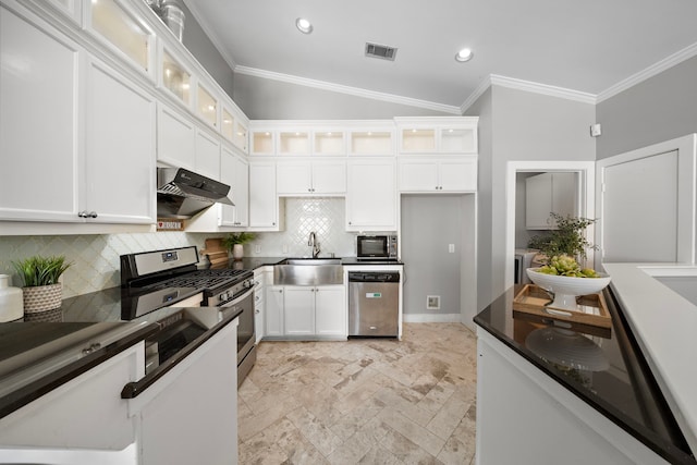 kitchen featuring visible vents, dark countertops, a sink, under cabinet range hood, and stainless steel appliances