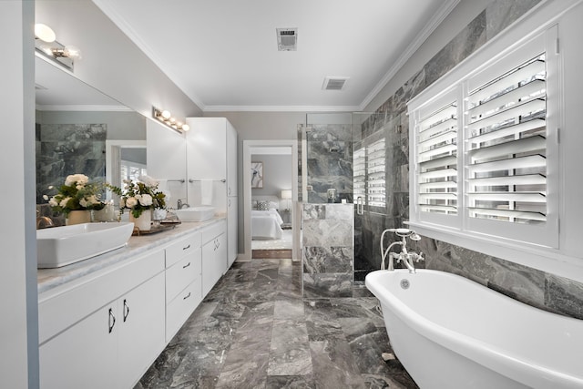 ensuite bathroom with visible vents, a healthy amount of sunlight, and a sink