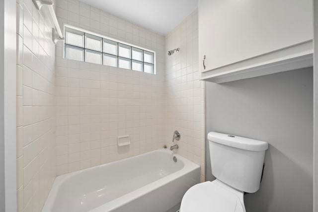 bathroom featuring shower / bathing tub combination and toilet