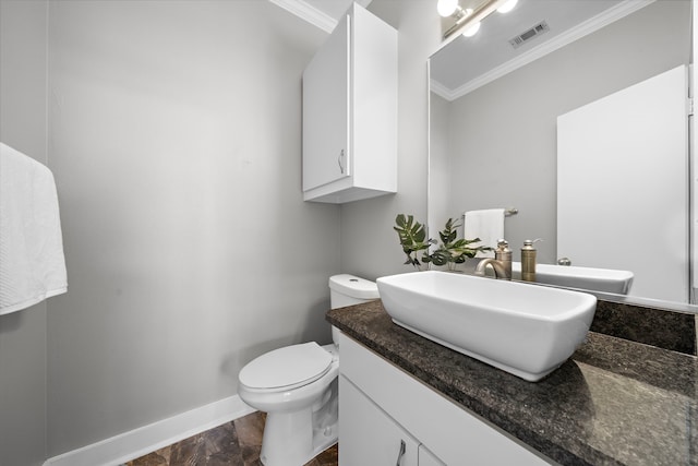 bathroom featuring vanity, ornamental molding, baseboards, and visible vents