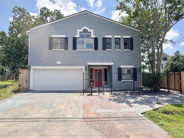 4917 Eigel St, Houston, TX 77007 - view of front of house featuring an attached garage, driveway, a fenced front yard, brick siding, and a gate