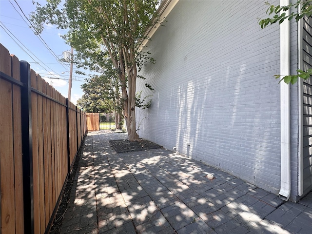 4917 Eigel St, Houston, TX 77007 - view of side of property featuring a patio and brick siding