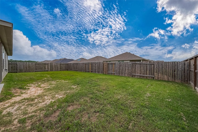 view of yard with a fenced backyard