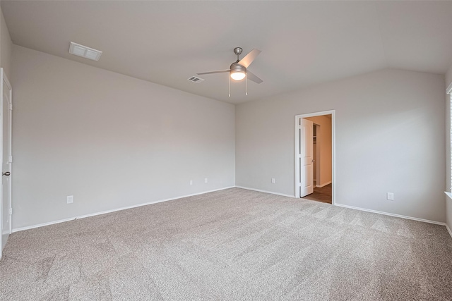 unfurnished room featuring carpet floors, ceiling fan, visible vents, and lofted ceiling