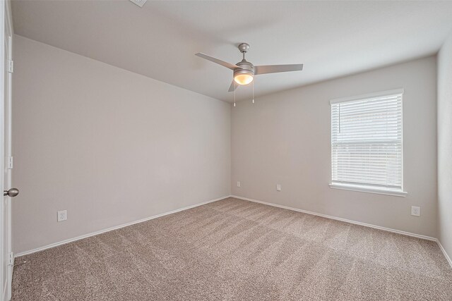 unfurnished room with baseboards, carpet, and ceiling fan