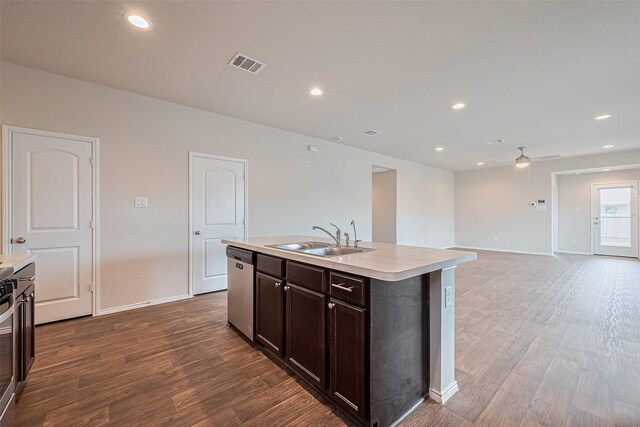 kitchen with visible vents, stainless steel dishwasher, ceiling fan, light countertops, and a sink