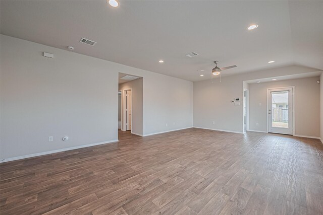 unfurnished room with a ceiling fan, visible vents, wood finished floors, and recessed lighting