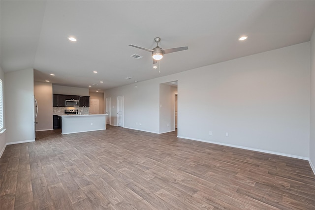 unfurnished living room featuring visible vents, baseboards, ceiling fan, recessed lighting, and light wood-type flooring