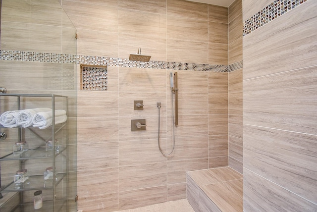 bathroom featuring a tile shower