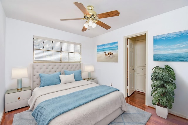 bedroom featuring a ceiling fan and wood finished floors