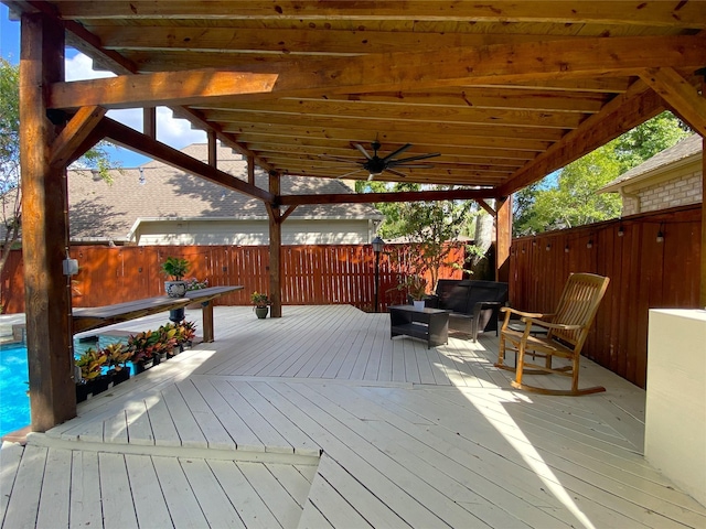 wooden deck featuring a fenced backyard and ceiling fan