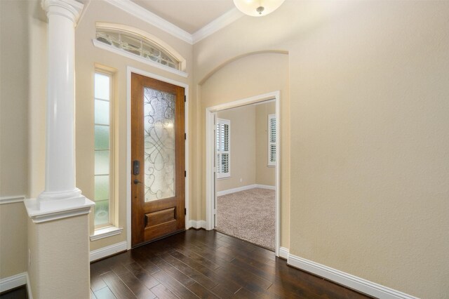 entrance foyer with baseboards, ornamental molding, ornate columns, and dark wood-type flooring