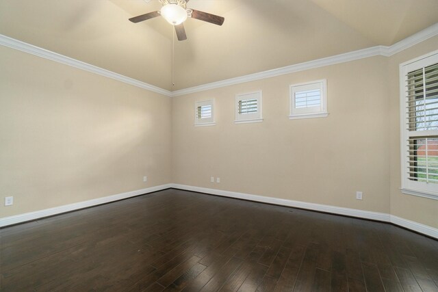 empty room with a healthy amount of sunlight, ceiling fan, dark wood finished floors, baseboards, and lofted ceiling